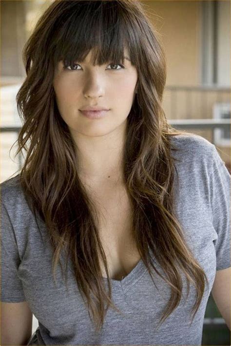 The side swept is heavy in this hairstyle and the layers begin from the chin, shoulder or neck to shape the style well. Effortless and Elegant Long Layered Haircuts with Bangs ...