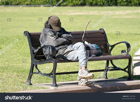 Homeless Man Sleeping On Park Bench Stock Photo Shutterstock