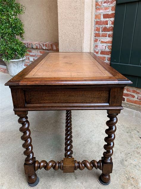 Easy to assemble and instructions were simple to follow. Antique English Carved Oak Barley Twist Library Desk Leather Top Hall Sofa Table For Sale at 1stdibs