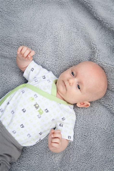 Adorable Bald Baby Boy With Big Blue Eyes Stock Image Image Of Hold