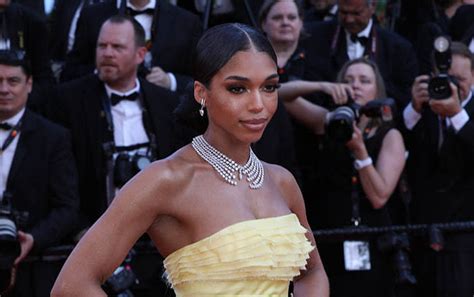 Lori Harvey Exudes Gilded Glamour In Ruffled Yellow Ballgown Gold