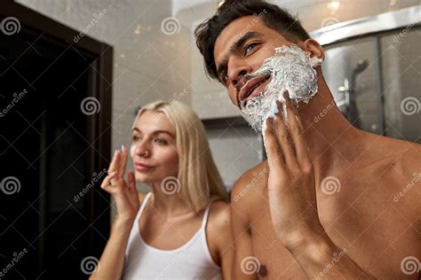 man smear shaving foam while girl smear cream stock image image of pampering bodycare 257948489
