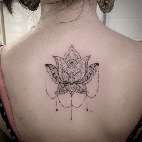 Upper Back Tattoo Of An Ornamental Style Lotus Flower