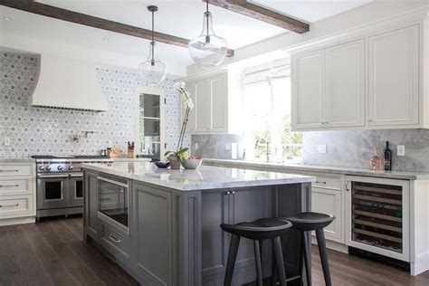 The ivory cabinets come with impressive materials and designs that make your kitchen a little heaven. Ivory and gray kitchen features ivory shaker cabinets ...