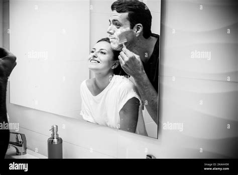 Black And White Young Couple Having Fun In The Bathroom At Home Man