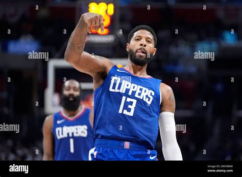 Los Angeles Clippers forward Paul George, right, gestures after sinking