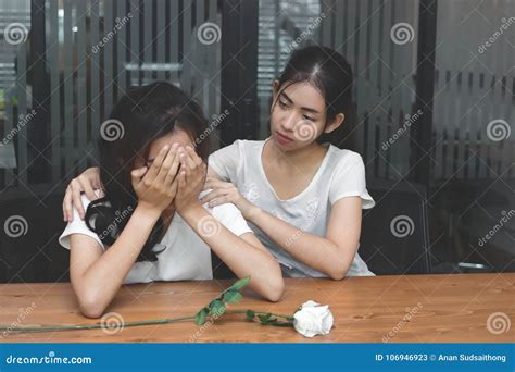 Vintage Toned Image Of Frustrated Stressed Asian Woman Comforting A Sad