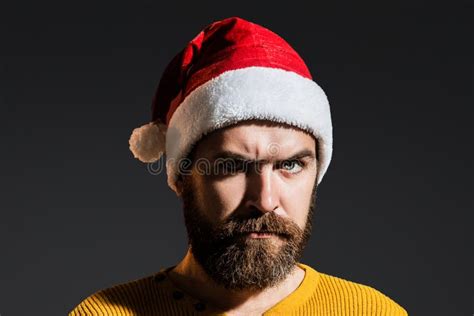 Handsome Bearded Man In Santa Hats Close Up Face Of Serious Santa