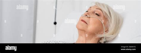 Senior Woman With Nasal Cannula Lying On Bed In Hospital Banner Stock Photo Alamy