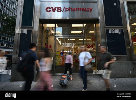 New York, USA. 01st Aug, 2023. People walk past the entrance to a CVS