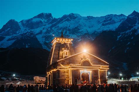 View Of The Kedarnath Temple Lights At Night With Mountains In The