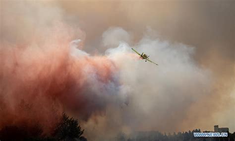Firefighting Plane Tries To Extinguish Forest Fire Near Northern
