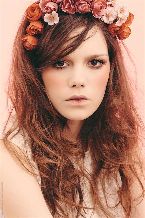 Portrait Of Young Beautiful Woman With Flower Crown In Hair By