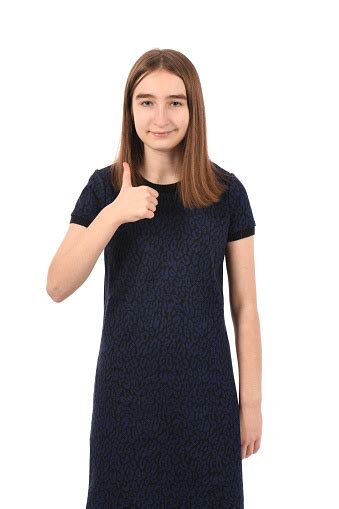Young Beautiful Girl In A Dark Blue Dress On A White Background Stock