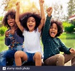 Happy African American boy and girl kids group playing in the ...