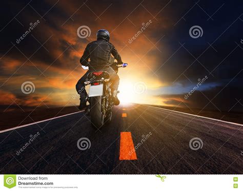 Young Man Riding Big Motorcycle On Asphalt Highway Use For People