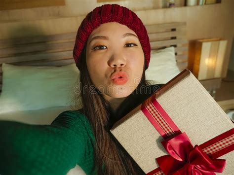 Young Beautiful And Happy Asian American Girl Taking Selfie Picture