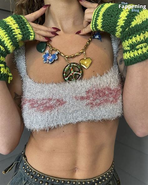 rita ora flashes her areola and shows off underboob 16 photos thefappening