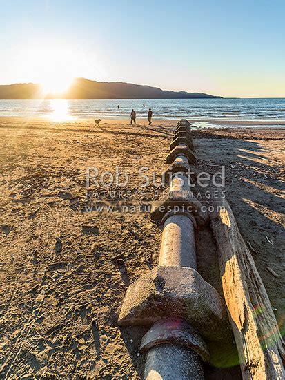 Stormwater Drains Pipes And Man Holes Exposed By Sand Erosion On Beach