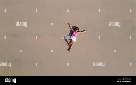 Top Aerial View Of A Woman Lying On A Tropical Beach Sand Stock Photo Alamy