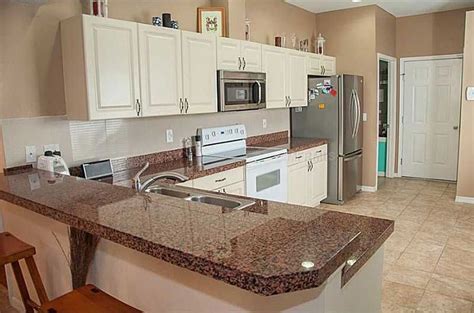 Brown Kitchen Cabinets With White Countertops Cabinets
