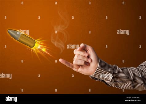 Gun Shaped Male Hand With Bullet Coming Out Of It Stock Photo Alamy