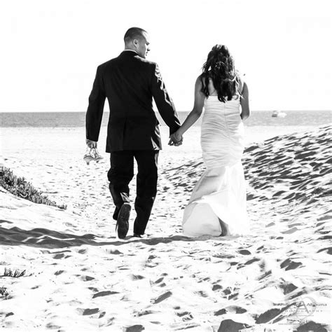 Black And White Wedding Photo Of Bride And Groom Walking Away Towards