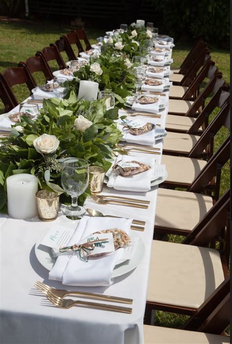 These chairs are easy to fold and can be conveniently stored. Dark wood folding chairs with banquet tables and white ...
