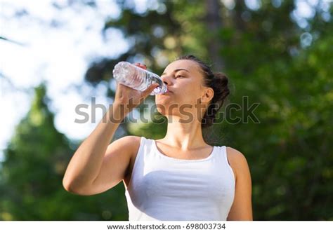 Female Fitness Model Drinking Water After Stock Photo 698003734