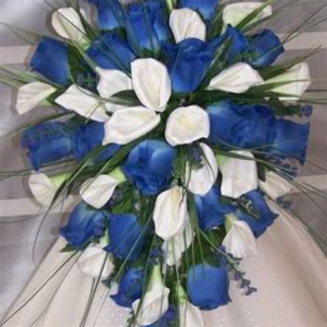 Looking for wedding flower ideas and inspiration? White calla lilies and blue roses | Flower bouquet wedding ...