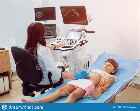 Medical Exam Of A Little Girl By Ultrasound Equipment Stock Image