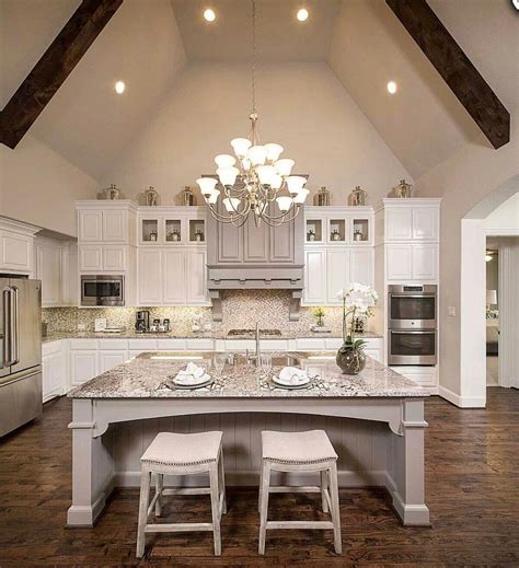 A custom home builder in chicago's western suburbs, summit signature homes, ushers in a new era of residential construction. Cathedral ceiling and a mix of white and grey cabinetry 👌🏼 ...