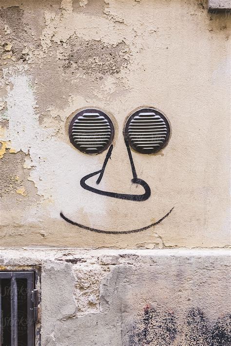 Funny Face Graffiti With Two Small Grates As Eyes By Stocksy