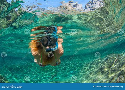 Woman Swim With Snorkel At Los Gigantes Beach In Tenerife Canary