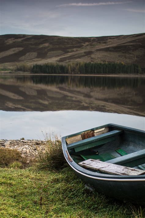 Download Boat Near A Lake Wallpaper