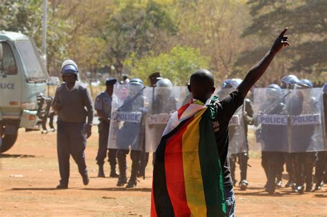 Police In Zimbabwe Hit Protesters With Batons Tear Gas And Water