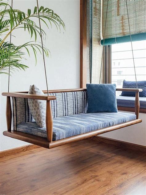 A Modern Wooden Swing Or Indian Jhoola With Back Support In Balcony