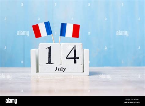 Wooden Calendar Of July 14th With Miniature France Flags French