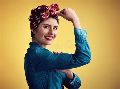 Strong Pinup Girl And Flexing Muscle Portrait In Studio For Beauty