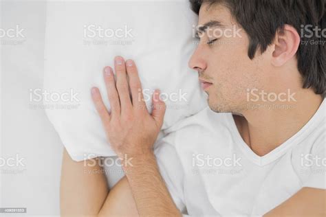 Young Man Sleeping In Bed Peacefully Stock Photo Download Image Now