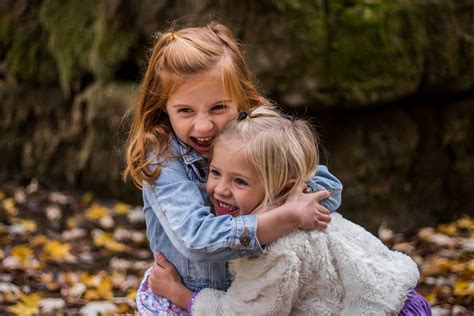 Female Toddlers Hugging Each Other Near Stone Hd Wallpaper Wallpaper