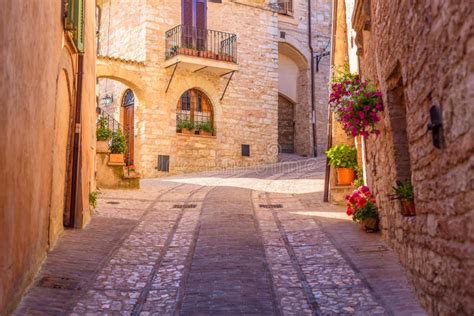 Beautiful View Of An Alley With Stone Buildings Decorated With The