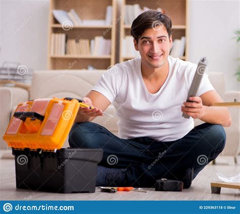 Man Assembling Shelf At Home Stock Photo Image Of Fixing Closet