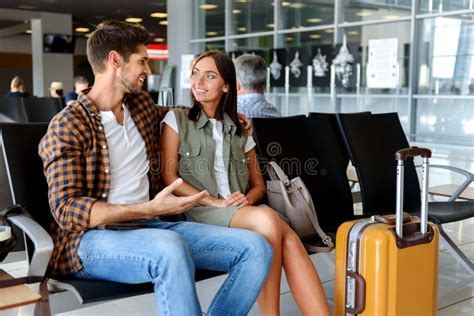 Happy Loving Couple Waiting For Flight Stock Photo Image Of Departure
