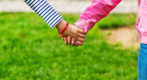 Children Holding Hands In The Park Stock Photo Image Of Friends