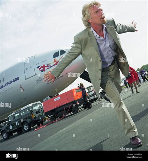 virgin chairman sir richard branson performs in front of the media during a publicity launch of