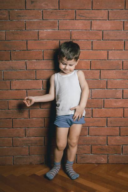 Happy smiling little kid in blue bathroom looking at himself in the mirror. Boys Underwear Stock Photos, Pictures & Royalty-Free ...