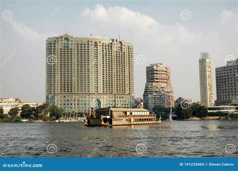 The Four Seasons Hotel Cairo Seen From The Nile With A Tour Boat
