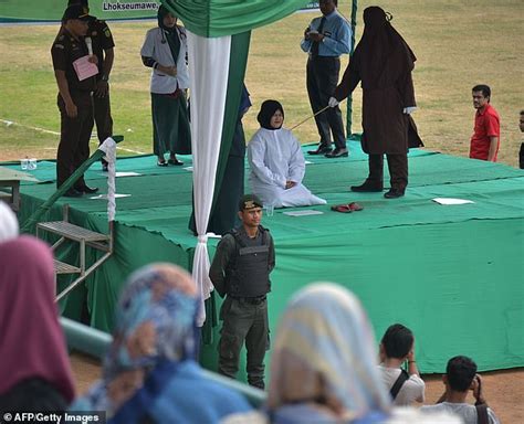 woman breaks down as she is publicly whipped 100 times for having pre marital sex in indonesia
