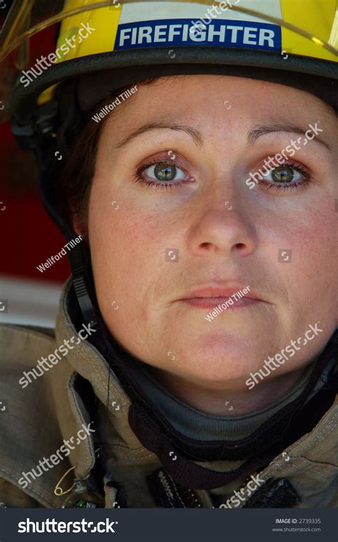 Close Up Of Female Firefighter Wearing Helmet Stock Photo 2739335